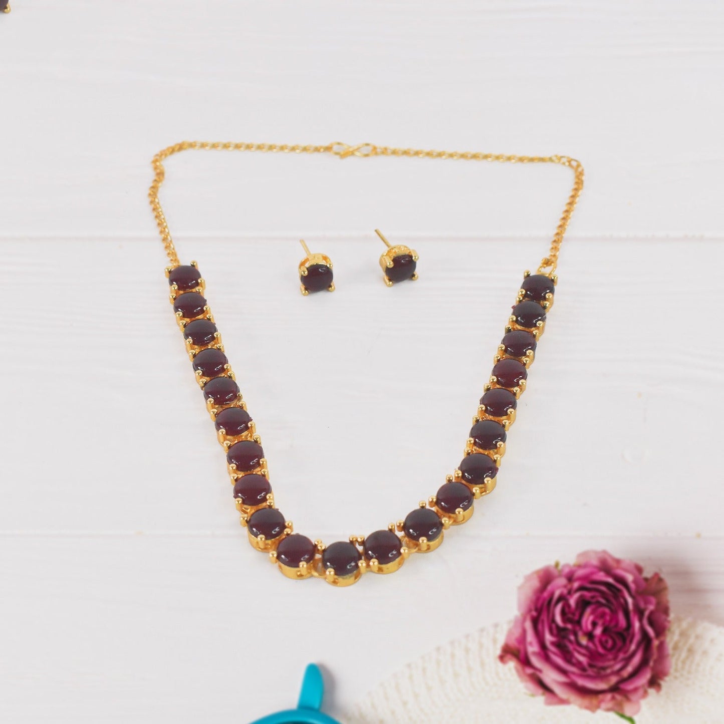 Kollam Supreme   Artificial Gold-Plated Brass Red American Diamond Stone Necklace Set