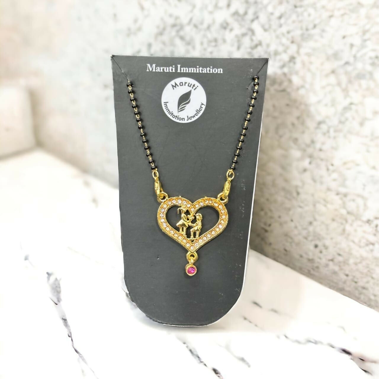 Artificial Gold-Tone Heart Mangalsutra with Intricate Couple Pendant and Stone Detailing